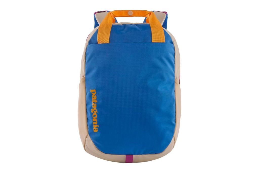 Bright blue backpack with yellow handle 