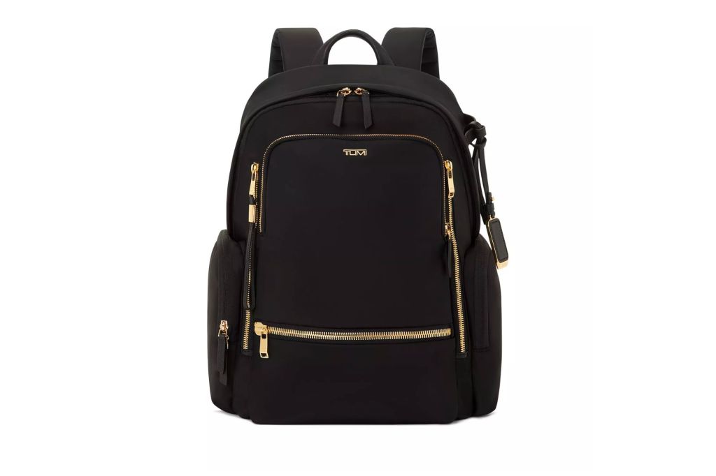 Black backpack from Tumi with gold accent hardware